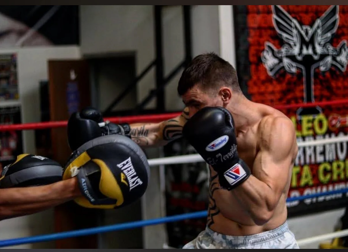 Ivan Redkach working mitts during fighter development training